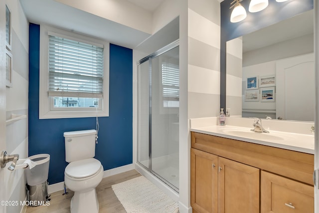 728 Brook Ave, Union Beach, NJ 07735 - full bath with toilet, a stall shower, vanity, wood finished floors, and baseboards
