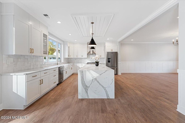 1119 Northstream Pkwy, Point Pleasant, NJ 08742 - kitchen featuring stainless steel appliances, ornamental molding, light wood finished floors, light stone countertops, and decorative backsplash