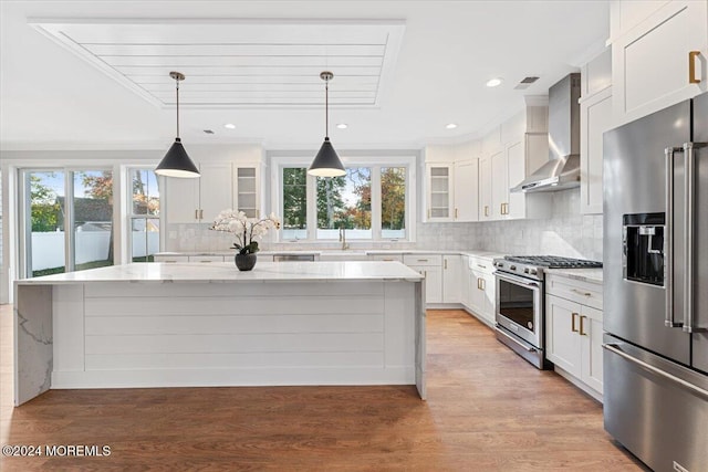 1119 Northstream Pkwy, Point Pleasant, NJ 08742 - kitchen featuring high quality appliances, wall chimney exhaust hood, plenty of natural light, a center island, and recessed lighting