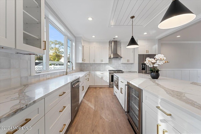 1119 Northstream Pkwy, Point Pleasant, NJ 08742 - kitchen with wall chimney range hood, wine cooler, stainless steel appliances, crown molding, and white cabinetry