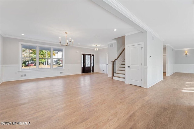 1119 Northstream Pkwy, Point Pleasant, NJ 08742 - unfurnished living room with a chandelier, stairs, crown molding, light wood-type flooring, and a wainscoted wall