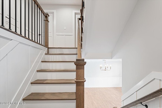 1119 Northstream Pkwy, Point Pleasant, NJ 08742 - stairway with a chandelier and wood finished floors