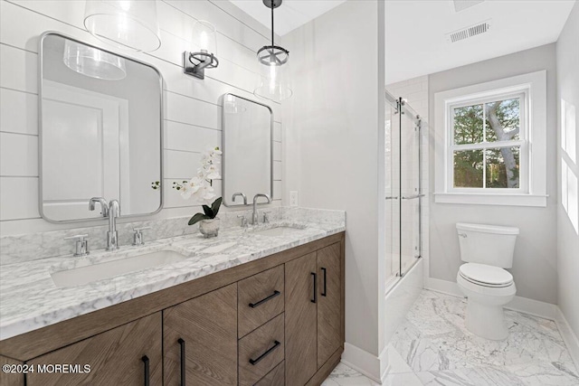 1119 Northstream Pkwy, Point Pleasant, NJ 08742 - bathroom with baseboards, marble finish floors, toilet, double vanity, and bath / shower combo with glass door