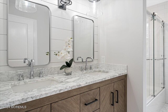 1119 Northstream Pkwy, Point Pleasant, NJ 08742 - bathroom with double vanity and enclosed tub / shower combo