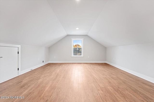 1119 Northstream Pkwy, Point Pleasant, NJ 08742 - additional living space with vaulted ceiling, light wood finished floors, and baseboards