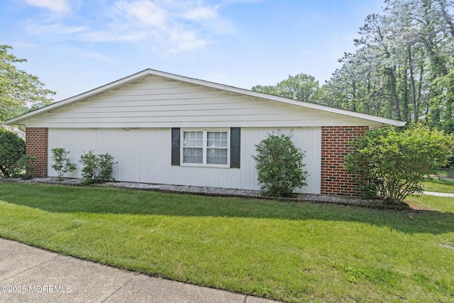 1036A Aberdeen Dr, Lakewood, NJ 08701 - view of side of home featuring a lawn and brick siding