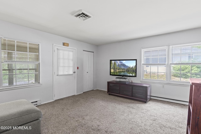 1036A Aberdeen Dr, Lakewood, NJ 08701 - carpeted living room with plenty of natural light, baseboard heating, and a baseboard radiator