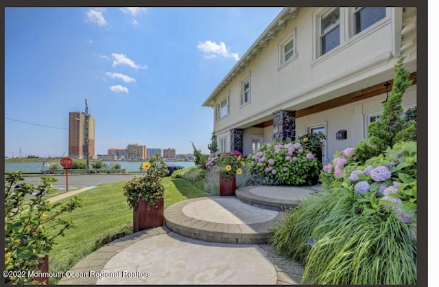 1 S Ocean Ave, Loch Arbour, NJ 07711 - view of patio / terrace with a water view