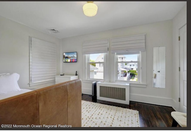 1 S Ocean Ave, Loch Arbour, NJ 07711 - office area featuring radiator heating unit, wood finished floors, and baseboards