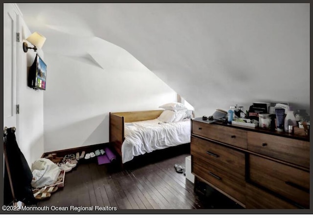 1 S Ocean Ave, Loch Arbour, NJ 07711 - bedroom with dark wood-style floors and lofted ceiling
