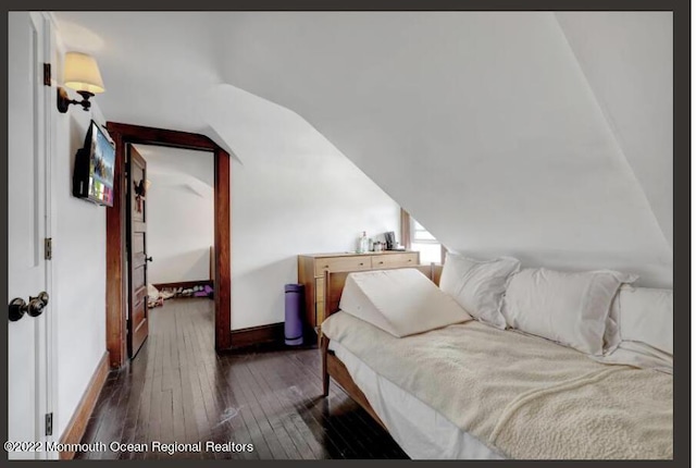 1 S Ocean Ave, Loch Arbour, NJ 07711 - bedroom with dark wood-type flooring, vaulted ceiling, and baseboards