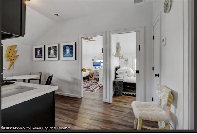 1 S Ocean Ave, Loch Arbour, NJ 07711 - office with dark wood-style flooring, a ceiling fan, lofted ceiling, baseboards, and a sink