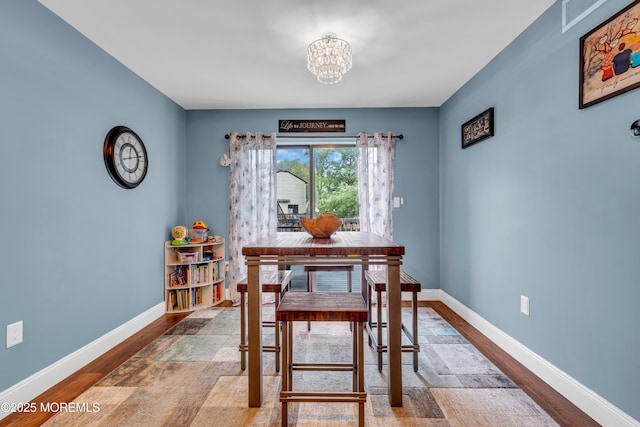11 Kennedy Ct, Middletown, NJ 07748 - dining room with a chandelier, wood finished floors, and baseboards