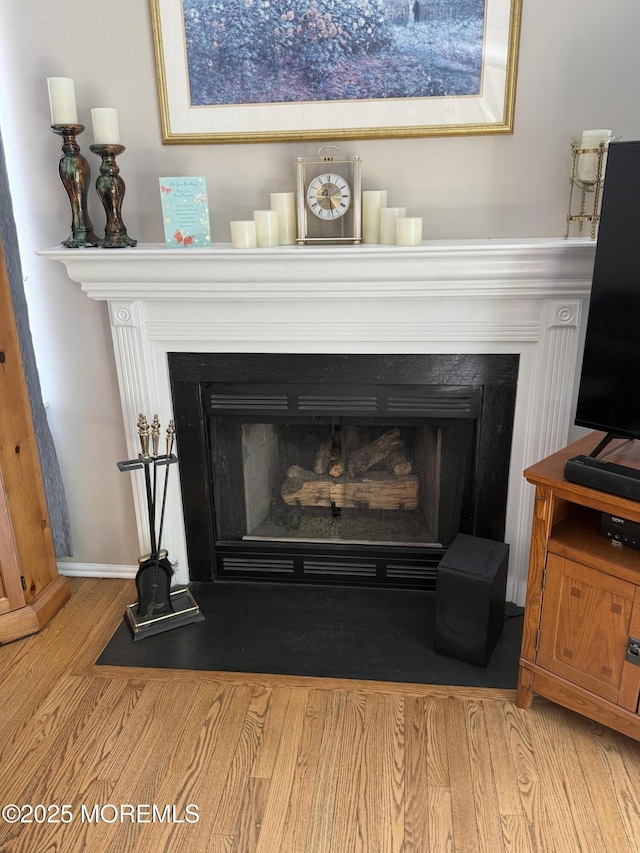 44 Diamond Ln, Howell, NJ 07731 - detailed view of a fireplace with flush hearth and wood finished floors