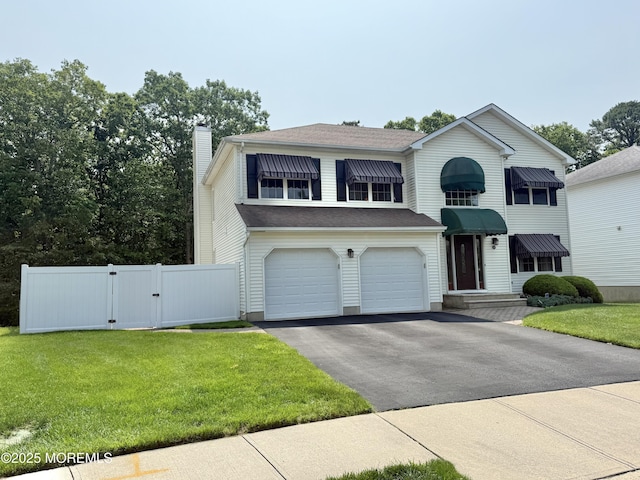 44 Diamond Ln, Howell, NJ 07731 - traditional-style house featuring a gate, asphalt driveway, a chimney, a garage, and roof with shingles