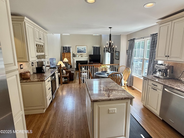 44 Diamond Ln, Howell, NJ 07731 - kitchen with dishwasher, a chandelier, decorative backsplash, wood finished floors, and recessed lighting