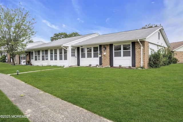 9 Edinburgh Ln Unit D, Manchester, NJ 08759 - ranch-style house with brick siding and a front yard