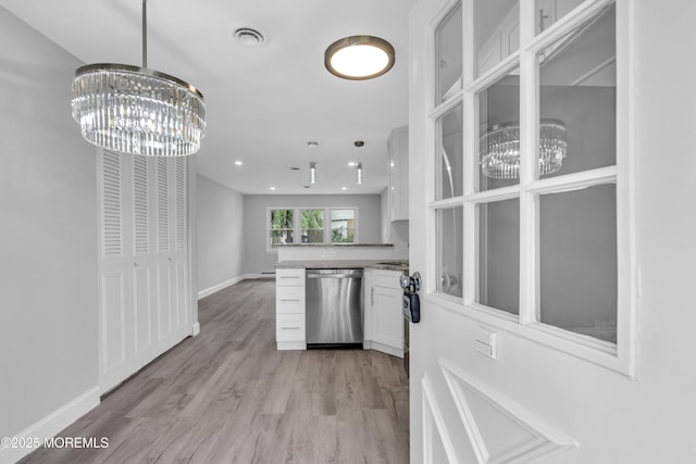 9 Edinburgh Ln Unit D, Manchester, NJ 08759 - kitchen featuring dishwasher, a chandelier, white cabinets, a peninsula, and light wood-style flooring