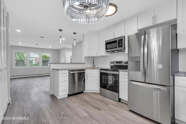 9 Edinburgh Ln Unit D, Manchester, NJ 08759 - kitchen featuring appliances with stainless steel finishes, white cabinets, light wood-type flooring, recessed lighting, and light stone counters