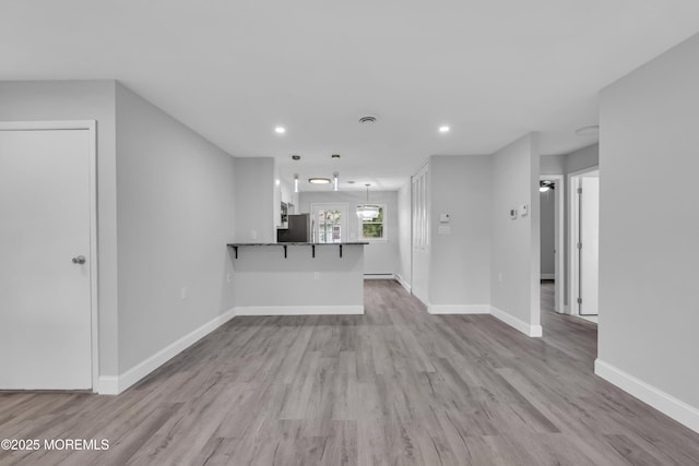 9 Edinburgh Ln Unit D, Manchester, NJ 08759 - unfurnished living room featuring baseboards, wood finished floors, and recessed lighting