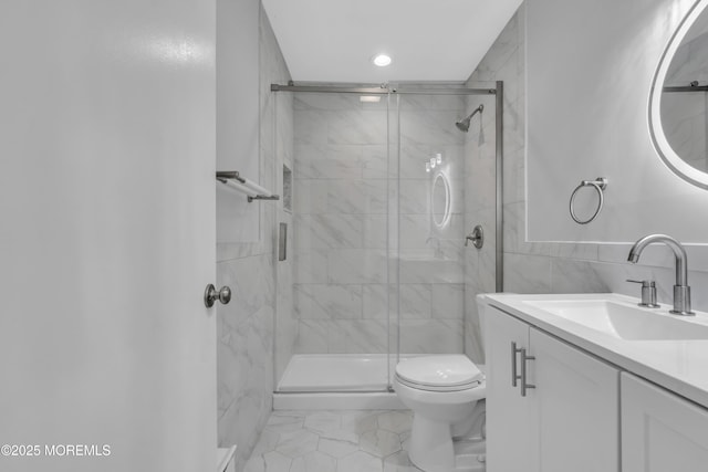 9 Edinburgh Ln Unit D, Manchester, NJ 08759 - bathroom featuring toilet, vanity, a shower stall, tile walls, and recessed lighting