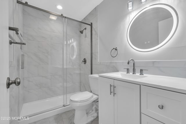 9 Edinburgh Ln Unit D, Manchester, NJ 08759 - bathroom featuring toilet, vanity, a shower stall, and tile walls