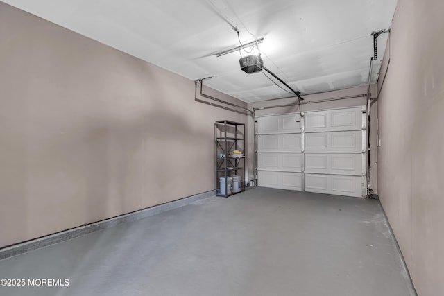 9 Edinburgh Ln Unit D, Manchester, NJ 08759 - garage with a garage door opener and baseboards
