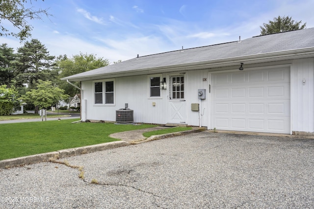 9 Edinburgh Ln Unit D, Manchester, NJ 08759 - view of front of property with a front lawn, an attached garage, cooling unit, and gravel driveway