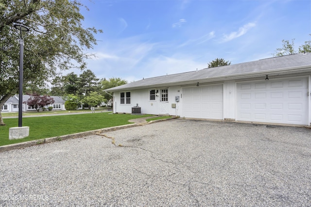 9 Edinburgh Ln Unit D, Manchester, NJ 08759 - ranch-style house featuring a garage, asphalt driveway, a front yard, and central AC unit