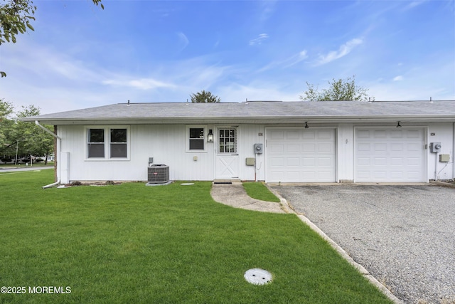 9 Edinburgh Ln Unit D, Manchester, NJ 08759 - view of front of home featuring an attached garage, driveway, central AC, and a front yard