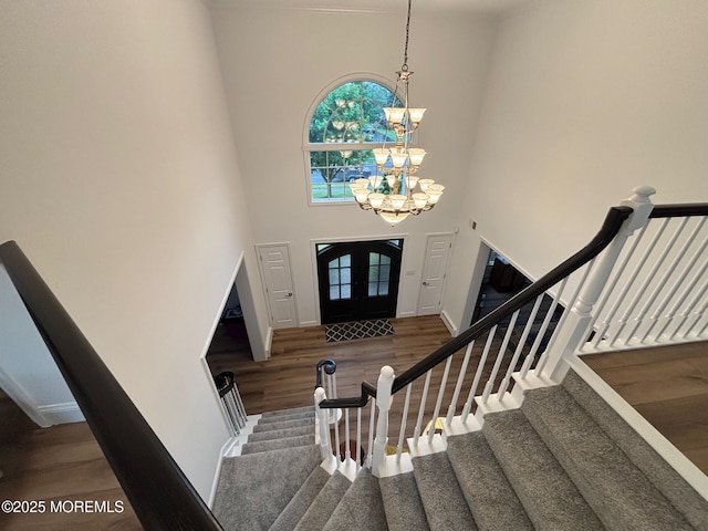 10 English Path, Freehold, NJ 07728 - foyer with a chandelier, a towering ceiling, wood finished floors, healthy amount of natural light, and stairway