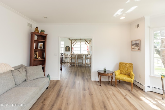 10 English Path, Freehold, NJ 07728 - living room with crown molding, healthy amount of natural light, light wood-style flooring, recessed lighting, and a baseboard radiator