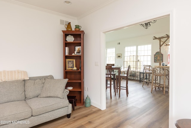 10 English Path, Freehold, NJ 07728 - living area featuring light wood-style flooring and crown molding