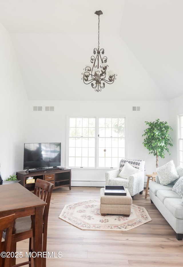 10 English Path, Freehold, NJ 07728 - living area with a chandelier, high vaulted ceiling, and wood finished floors