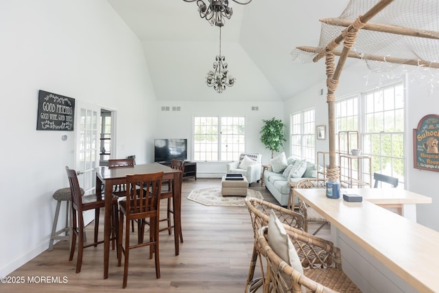 10 English Path, Freehold, NJ 07728 - dining room featuring a chandelier, high vaulted ceiling, wood finished floors, and an office area