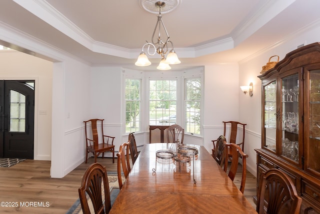 10 English Path, Freehold, NJ 07728 - dining room featuring light wood-style flooring, a tray ceiling, crown molding, and a chandelier