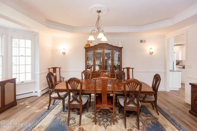 10 English Path, Freehold, NJ 07728 - dining space with a baseboard radiator, light wood-style flooring, and ornamental molding