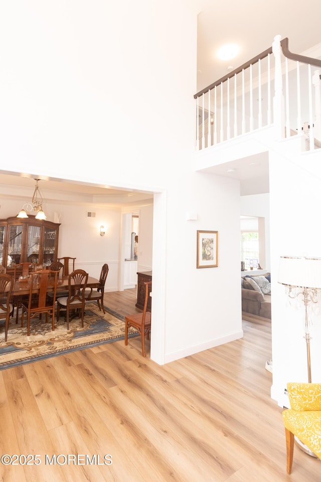 10 English Path, Freehold, NJ 07728 - dining area featuring light wood-style flooring and a towering ceiling