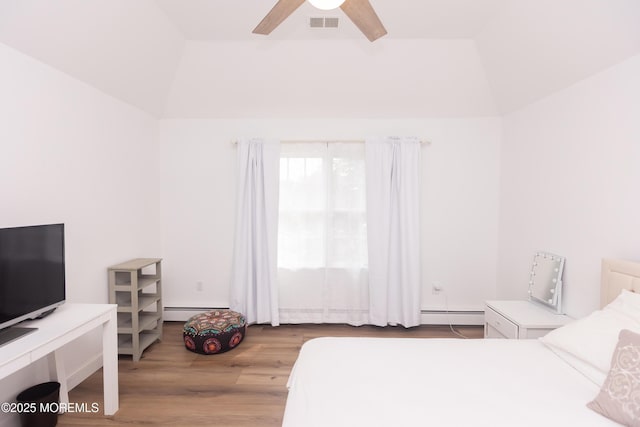 10 English Path, Freehold, NJ 07728 - bedroom with baseboard heating, wood finished floors, vaulted ceiling, and a ceiling fan