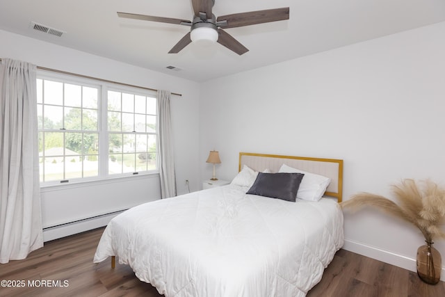 10 English Path, Freehold, NJ 07728 - bedroom with baseboard heating, wood finished floors, and ceiling fan