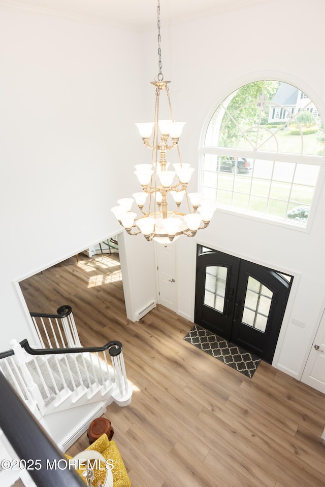 10 English Path, Freehold, NJ 07728 - foyer featuring a chandelier, light wood-style flooring, and crown molding
