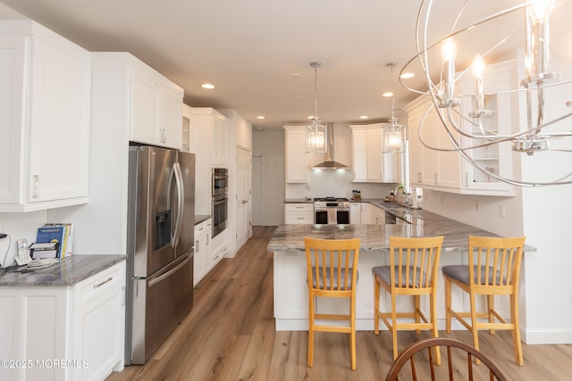 10 English Path, Freehold, NJ 07728 - kitchen featuring stainless steel appliances, a peninsula, light wood-type flooring, wall chimney range hood, and recessed lighting