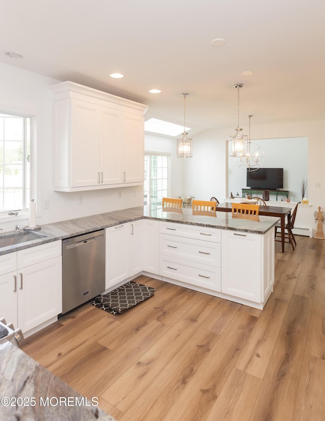 10 English Path, Freehold, NJ 07728 - kitchen featuring dishwasher, white cabinets, light wood-type flooring, a peninsula, and light stone countertops