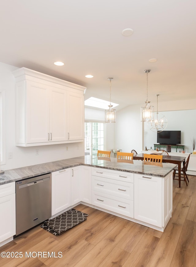 10 English Path, Freehold, NJ 07728 - kitchen with stainless steel dishwasher, white cabinetry, light wood finished floors, a chandelier, and recessed lighting