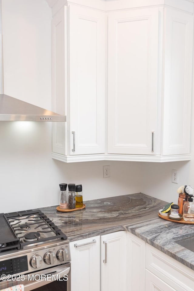 10 English Path, Freehold, NJ 07728 - kitchen featuring gas range, wall chimney range hood, and white cabinetry