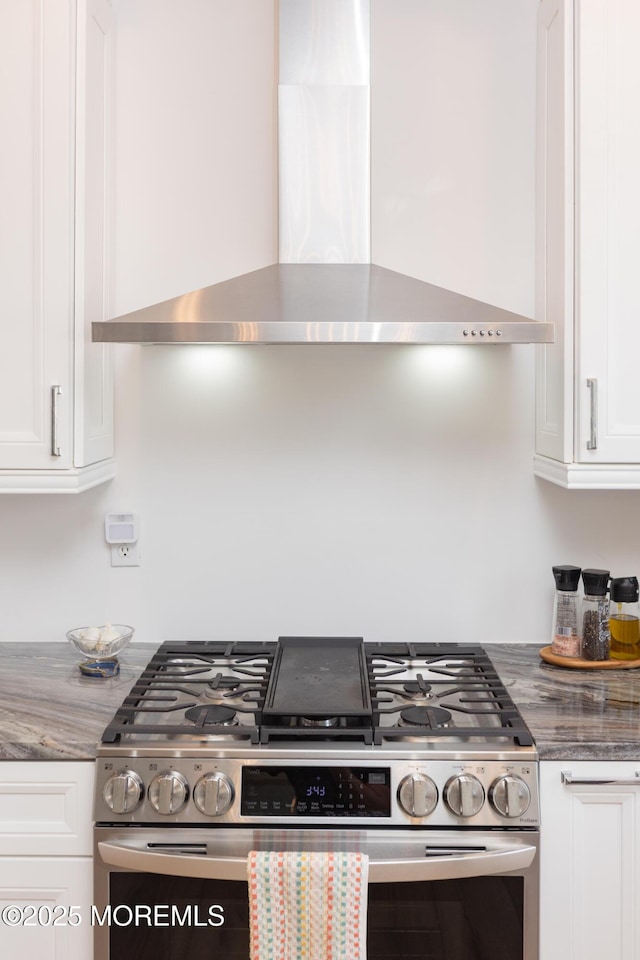 10 English Path, Freehold, NJ 07728 - kitchen with wall chimney range hood, stainless steel range with gas cooktop, and white cabinets