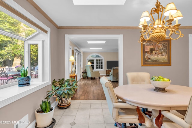 1 Algonquin Dr, Marlboro, NJ 07746 - dining area with a chandelier, a skylight, light tile patterned flooring, and ornamental molding