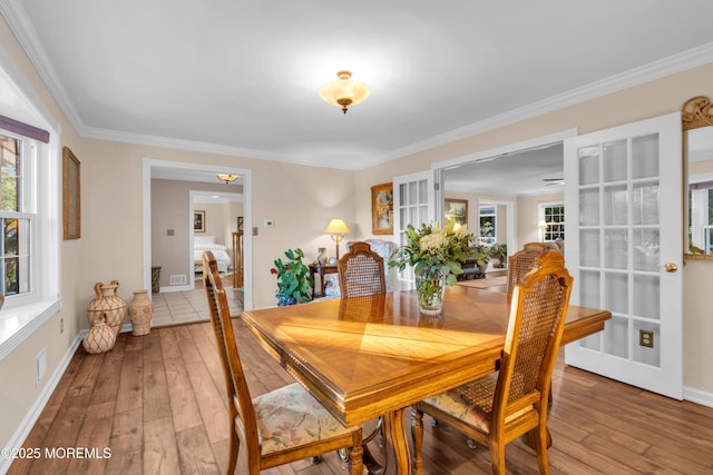1 Algonquin Dr, Marlboro, NJ 07746 - dining area featuring light wood-style floors and ornamental molding