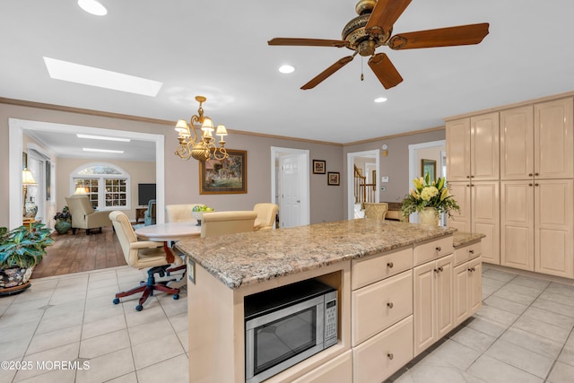 1 Algonquin Dr, Marlboro, NJ 07746 - kitchen featuring stainless steel microwave, light tile patterned floors, light stone countertops, crown molding, and recessed lighting