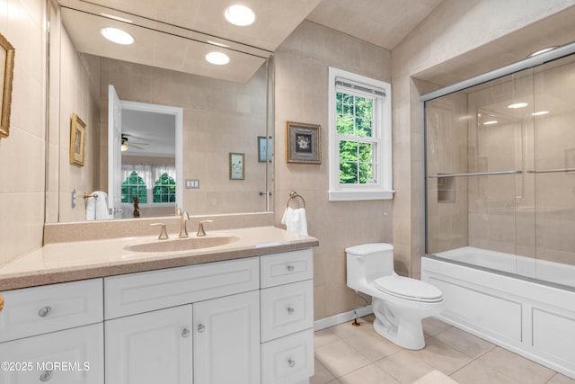 1 Algonquin Dr, Marlboro, NJ 07746 - full bath featuring tile patterned flooring, tile walls, vanity, enclosed tub / shower combo, and a ceiling fan
